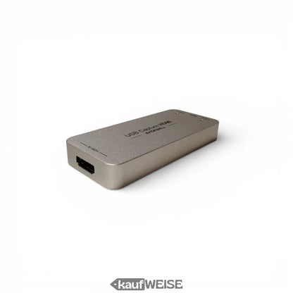 Silberner rechteckiger Magewell USB Capture HDMI Gen 2 Adapter, matt, mit beschrifteten Ports